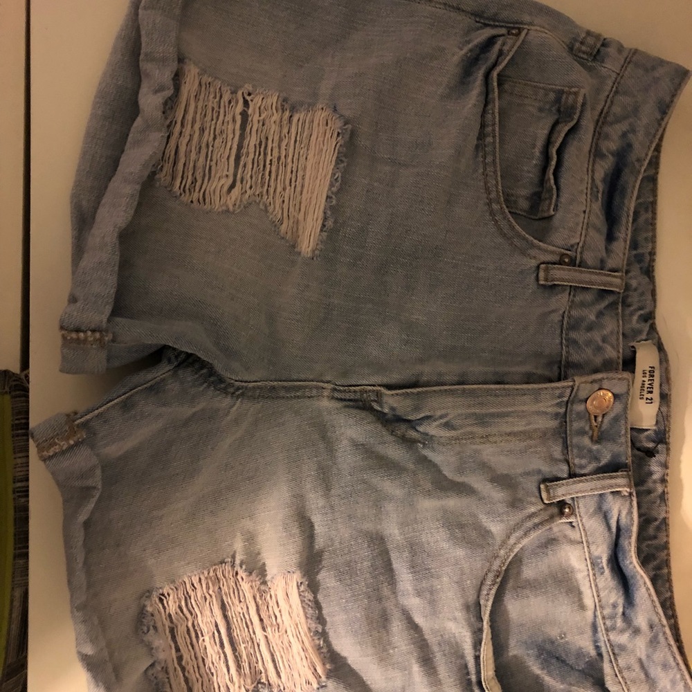 Ripped light wash shorts